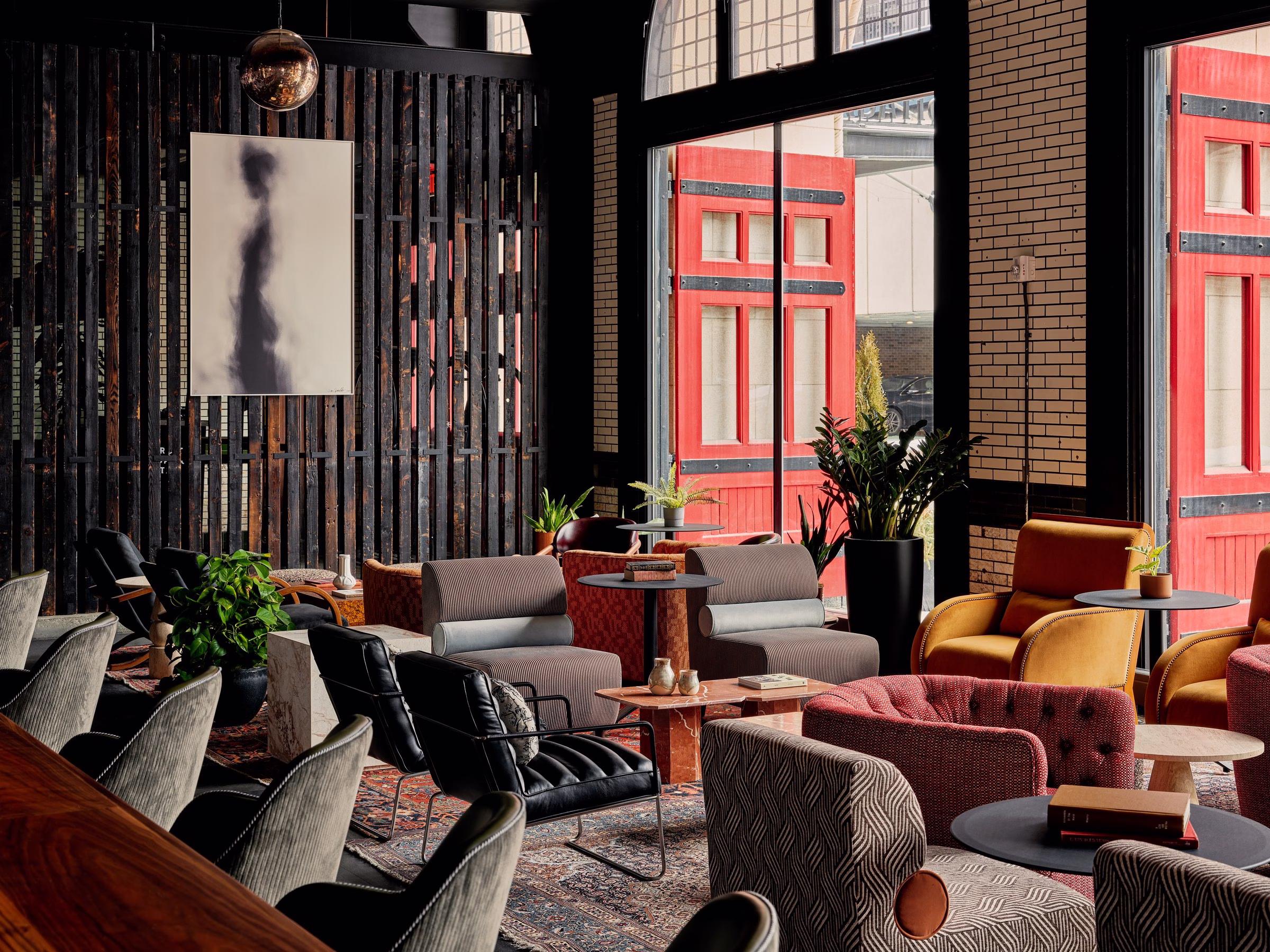 Detroit Foundation Hotel lounge with pink velvet chairs and skylit conservatory ceiling