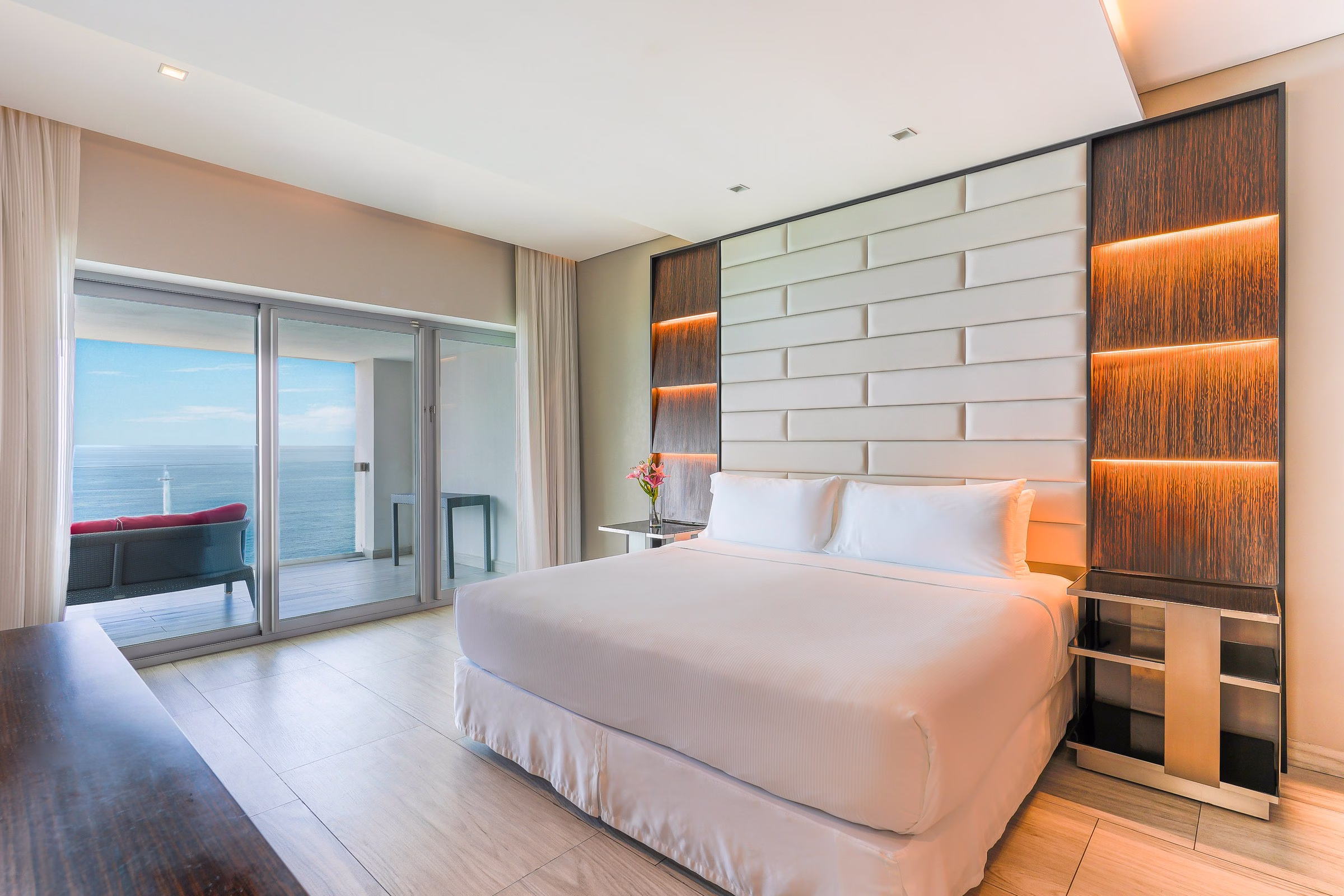 Hilton Vallarta Riviera ocean-view guest room with king bed, private balcony, and Bahia de Banderas view