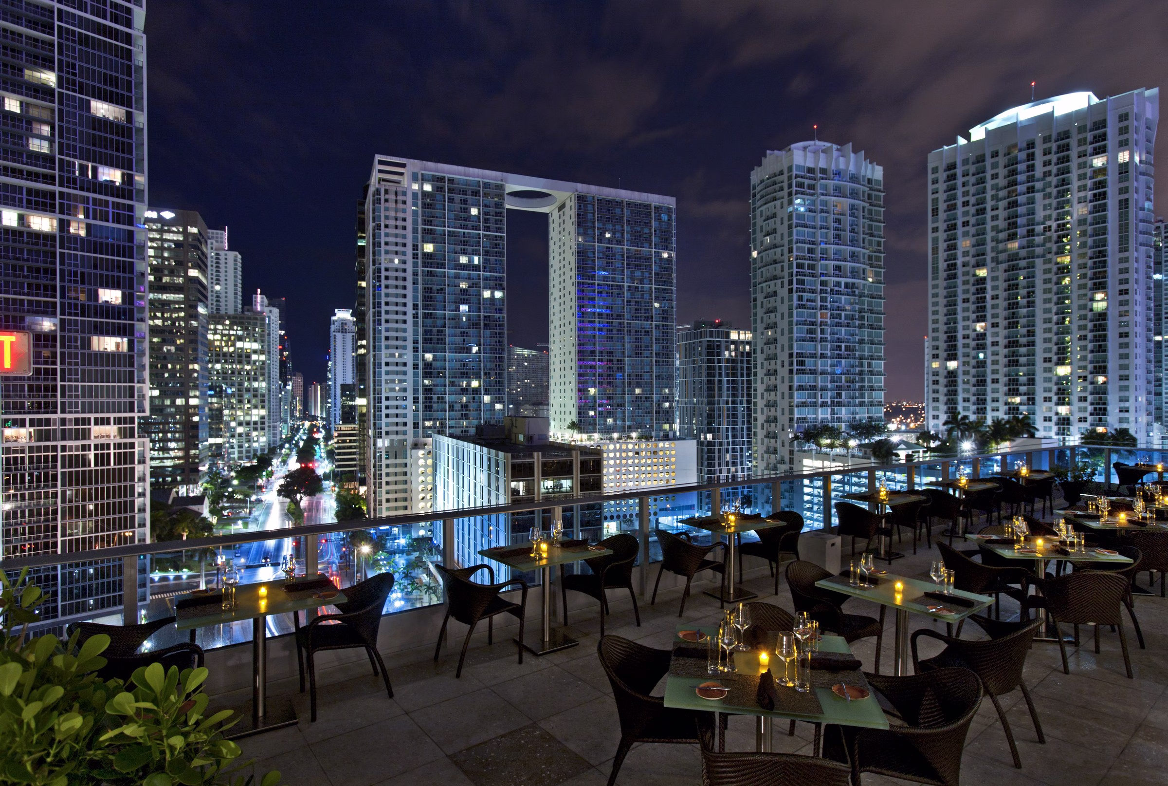 Kimpton EPIC Hotel Miami one-bedroom suite with king bed, ocean-facing balcony, and Biscayne Bay view