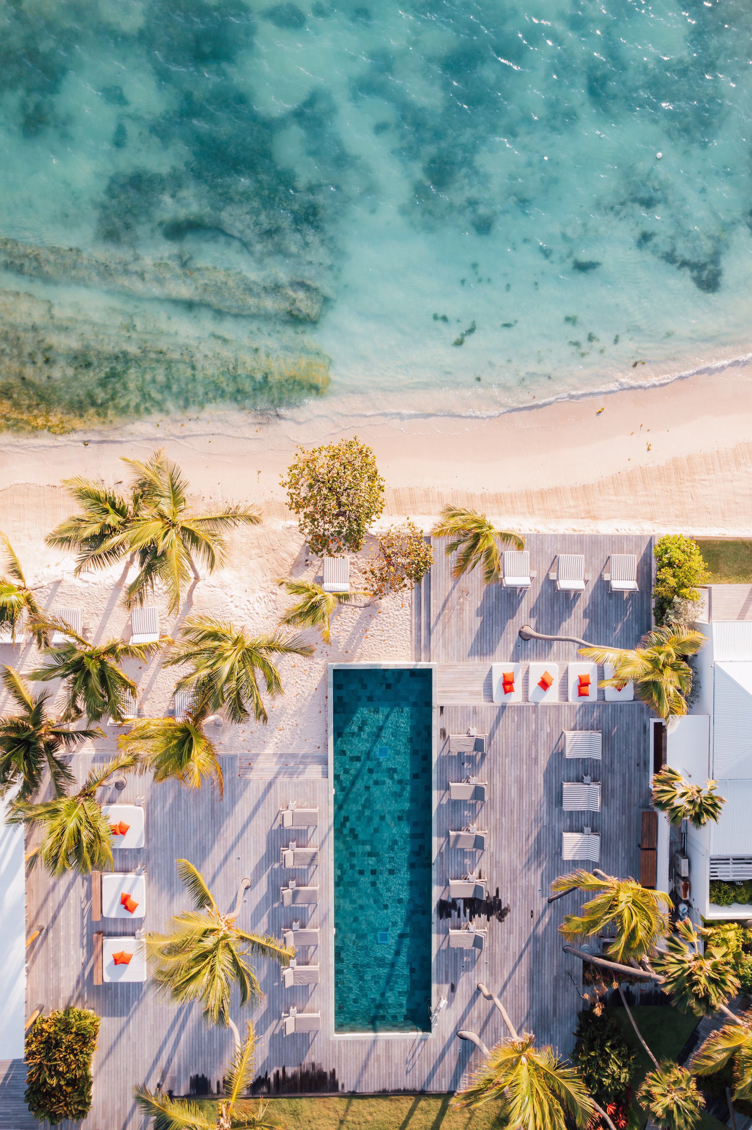 Le Sereno St Barths drone aerial of Grand Cul-de-Sac beach, coral reef, and resort cabanas