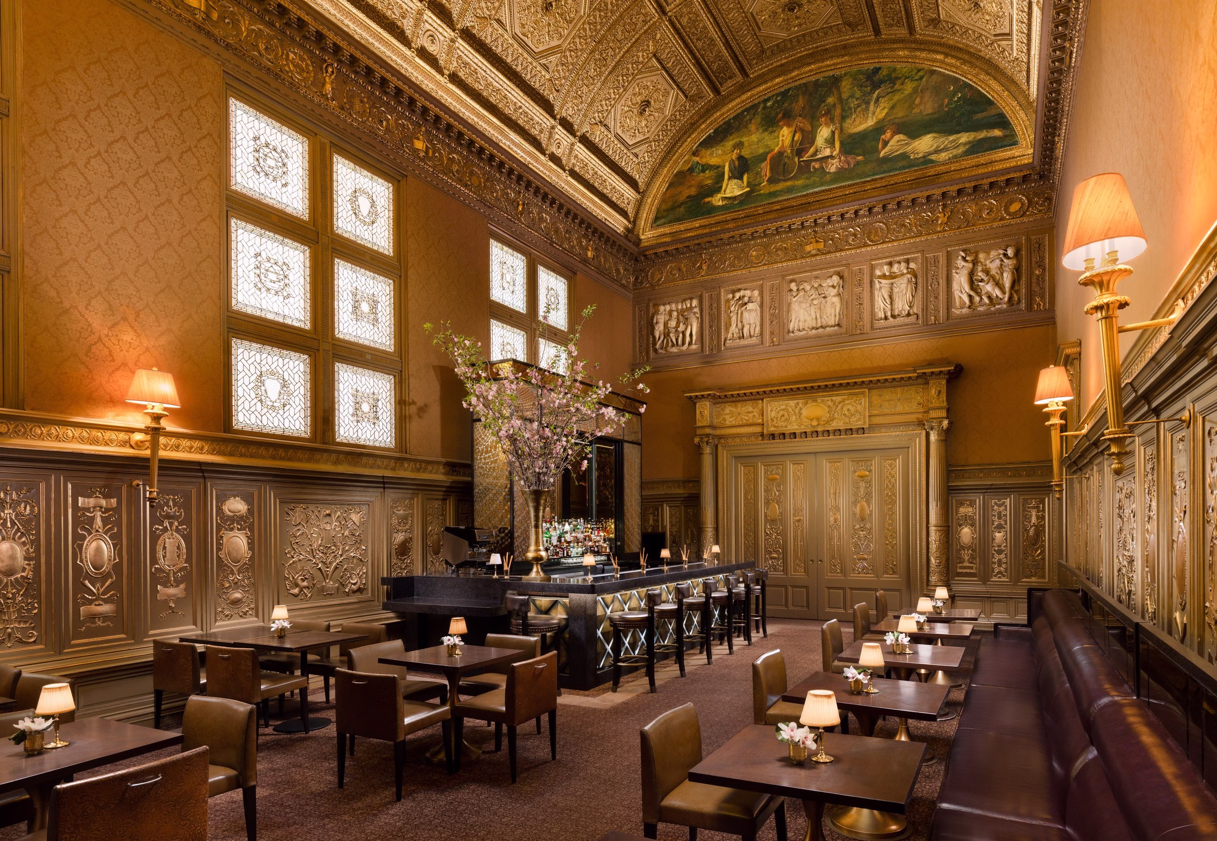Lotte New York Palace Gold Room cocktail bar with gilded ceiling and elegant lounge seating