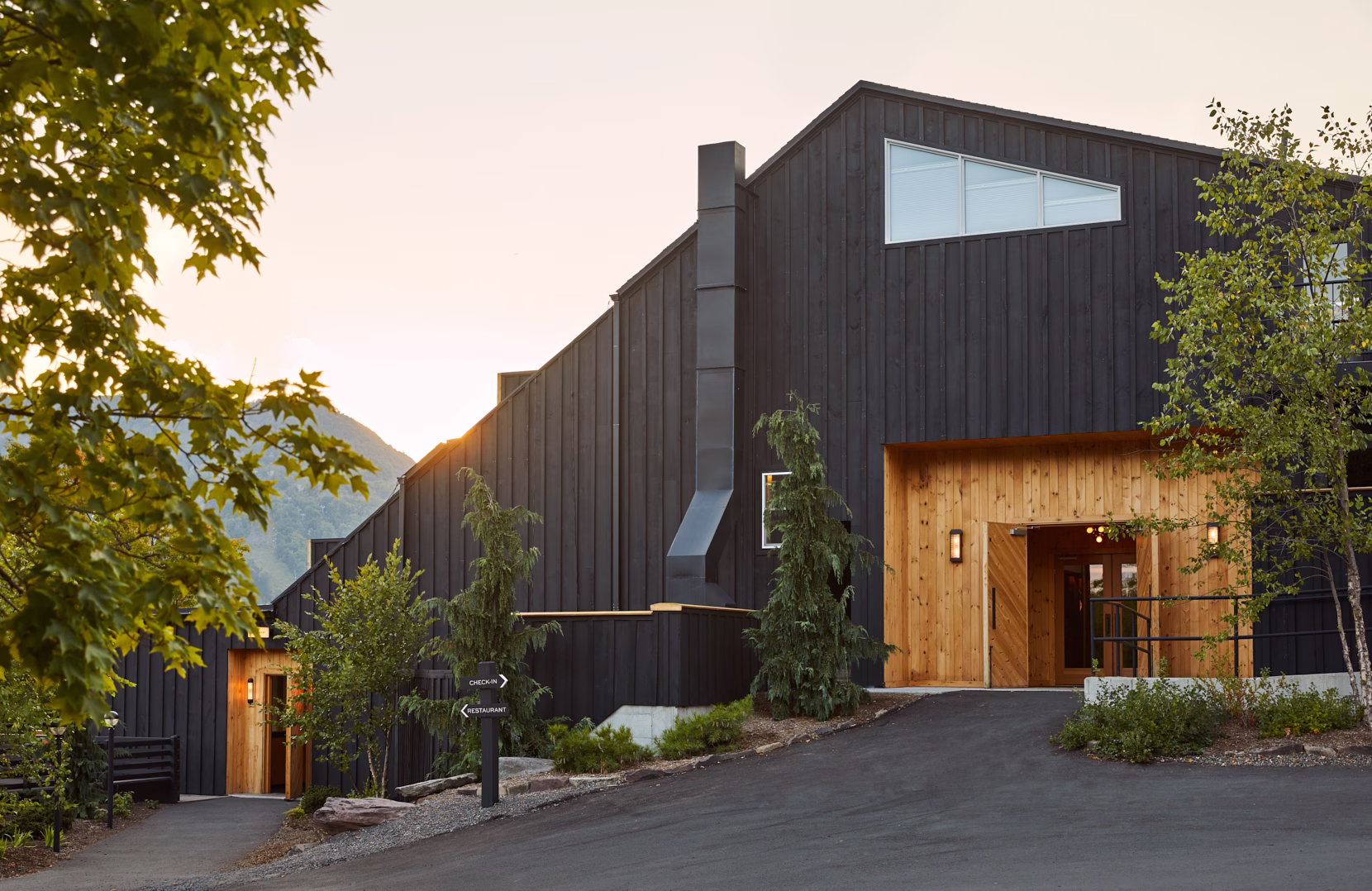 Scribner's Catskill Lodge exterior shot with Hunter Mountain rising behind the property