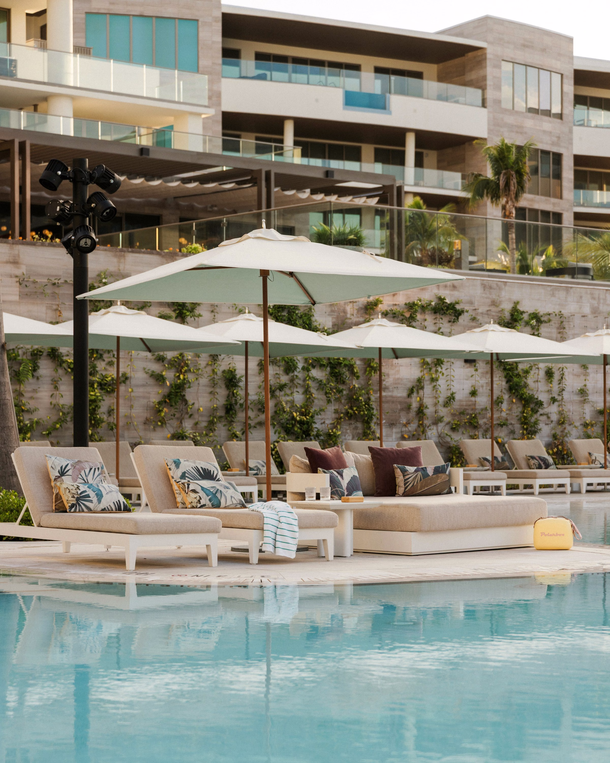 St. Regis Longboat Key Pools courtyard with private cabanas surrounded by lush palms