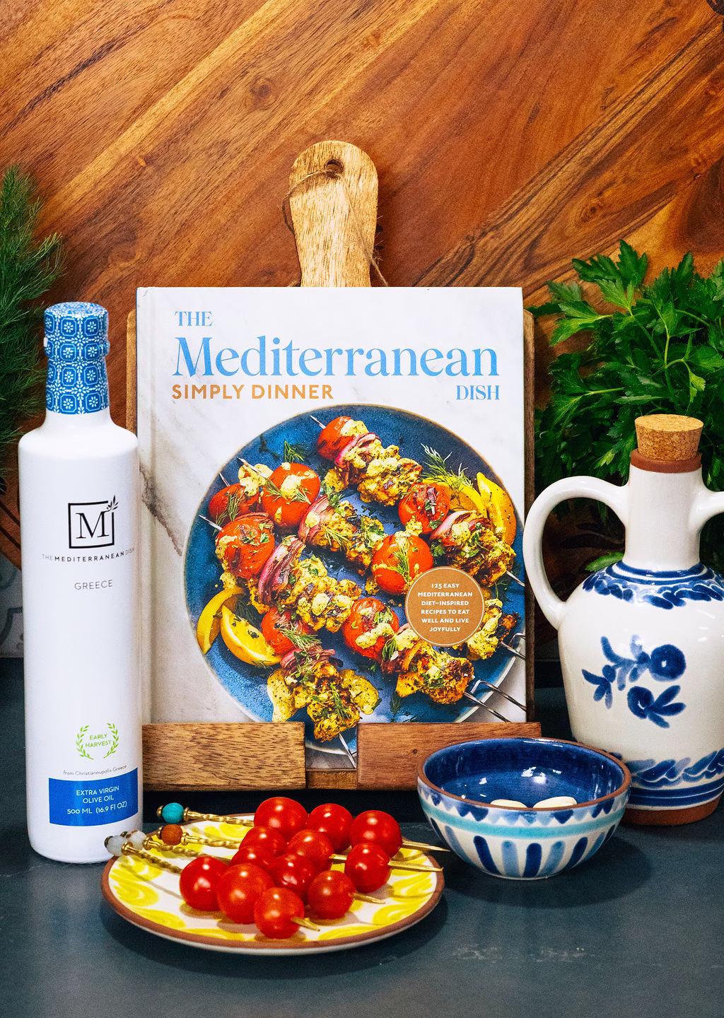 The Mediterranean Dish founder Suzy Karadsheh portrait in a Mediterranean-styled kitchen